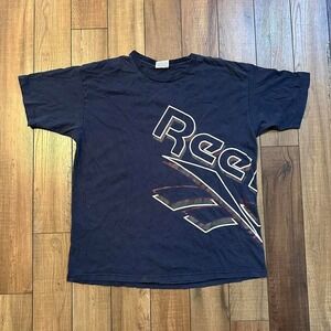 Vintage Reebok big logo wrap around graphic navy blue tee‎ XL